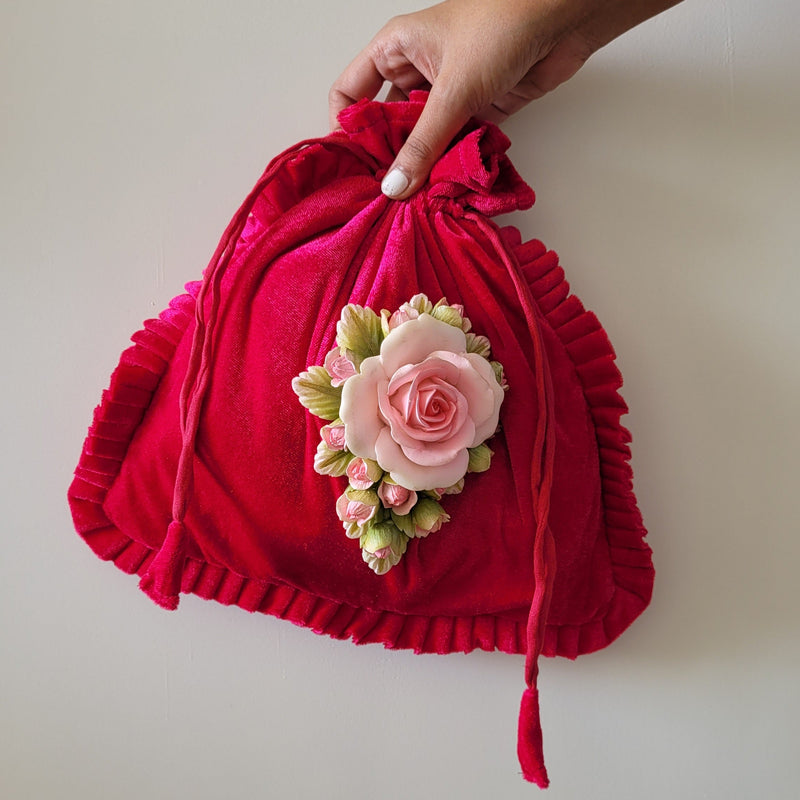 Punch rose embellished Potli Bag